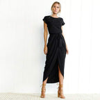 Back view of navy maxi dress showing short sleeves and skirt drape