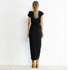 Detail shot of round neckline and short sleeve on navy wrap dress