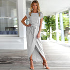 Close-up of wrap skirt front slit and draping on navy maxi dress
