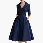 Navy satin wrap midi dress with 3/4 sleeves and pleated skirt, front view