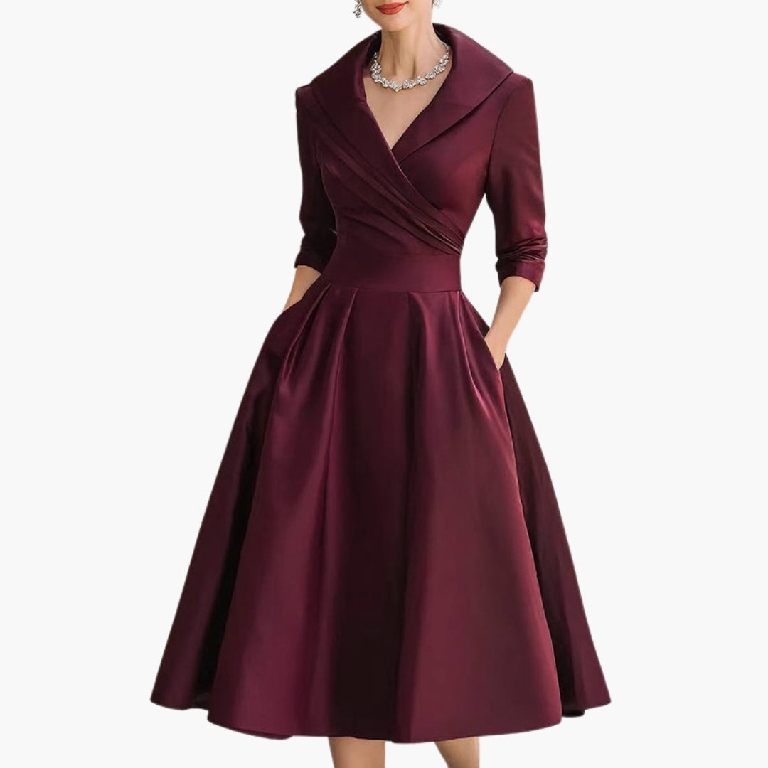 Model wearing navy midi dress, full-length side profile pose