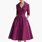 Rear view of midi dress showing draped back and sleeve detail