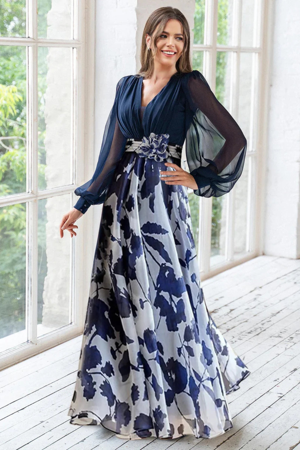 Full-length view of floral maxi dress showing pleated bodice and flowing skirt