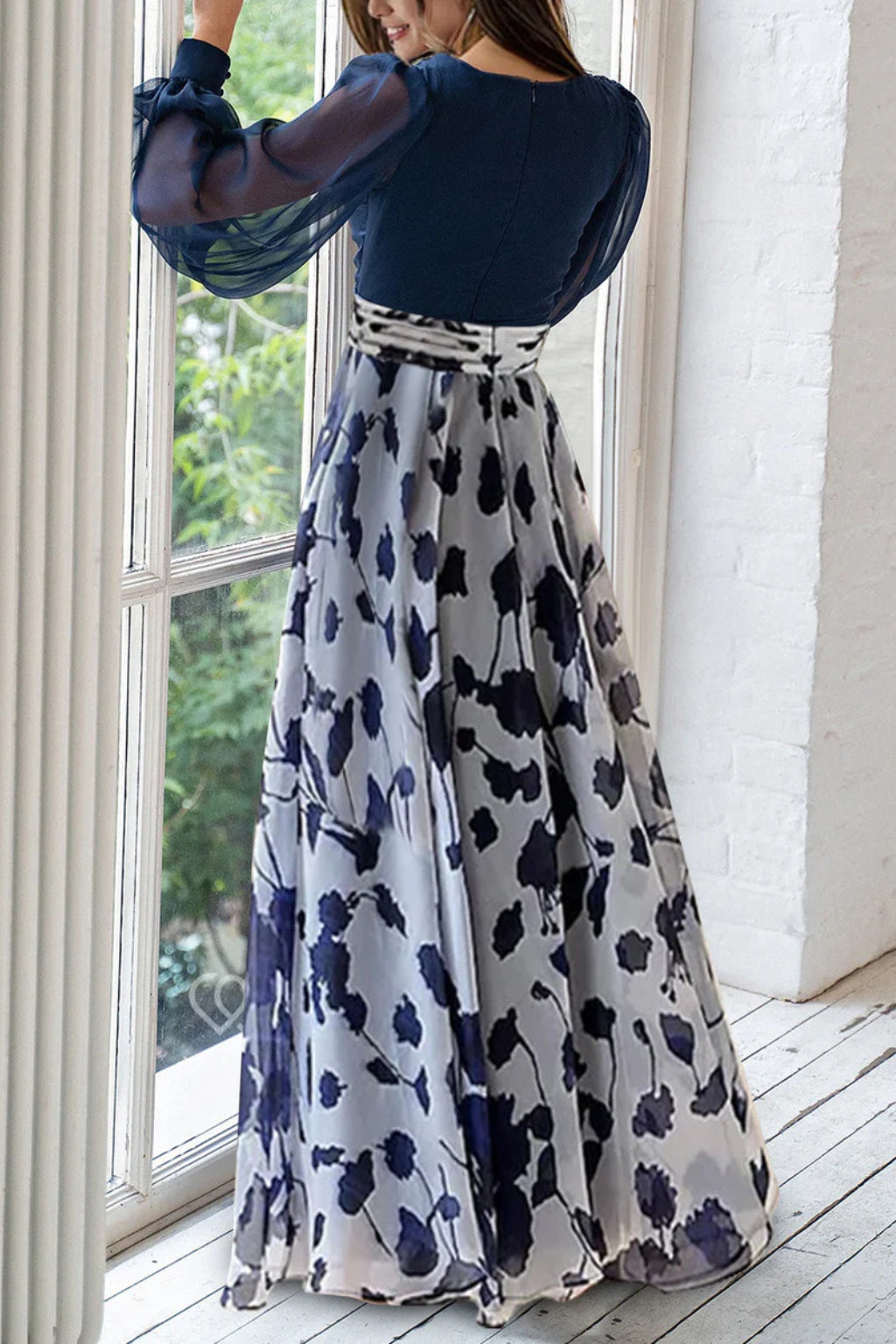 Close-up of V-neckline and sheer balloon sleeve detail