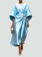 Side view of maxi dress highlighting flowing satin fabric and sleeve design