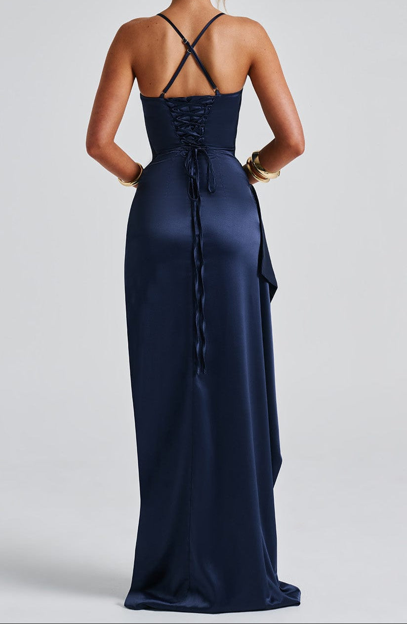Rear view of navy satin maxi dress, showing back drape