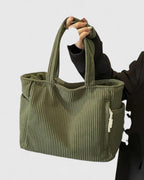 Olive green corduroy tote bag displayed front-on showing full silhouette