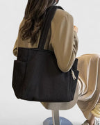 Side view showing exterior pocket detail and bag structure