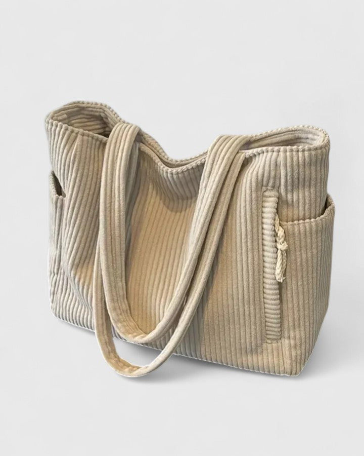 Rear view of tote bag highlighting back pocket and overall shape