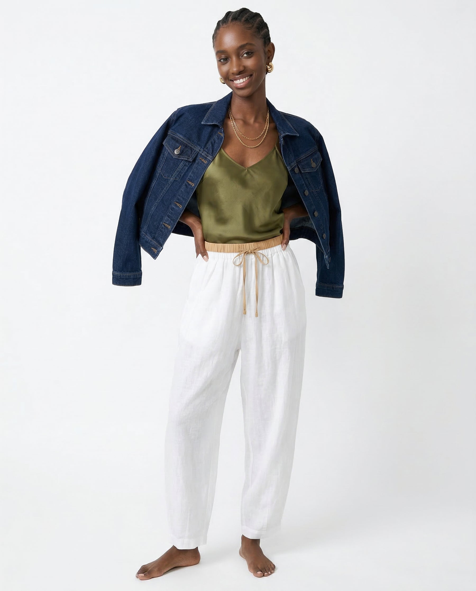Ankle and hem detail of tapered peach linen trousers