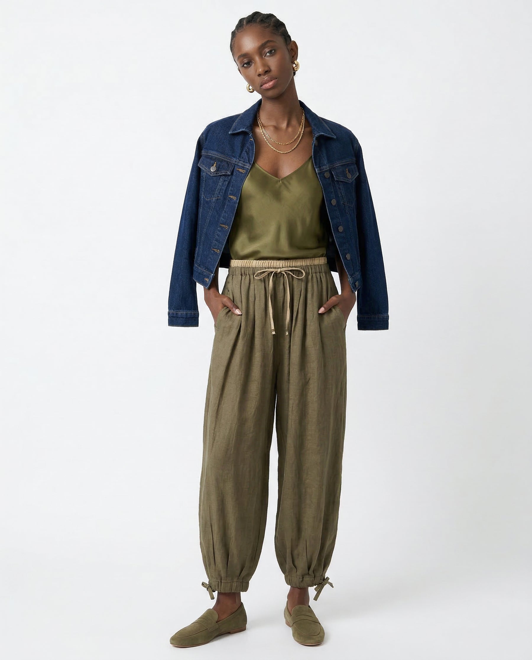 Close-up texture of 100% linen fabric on peach trousers