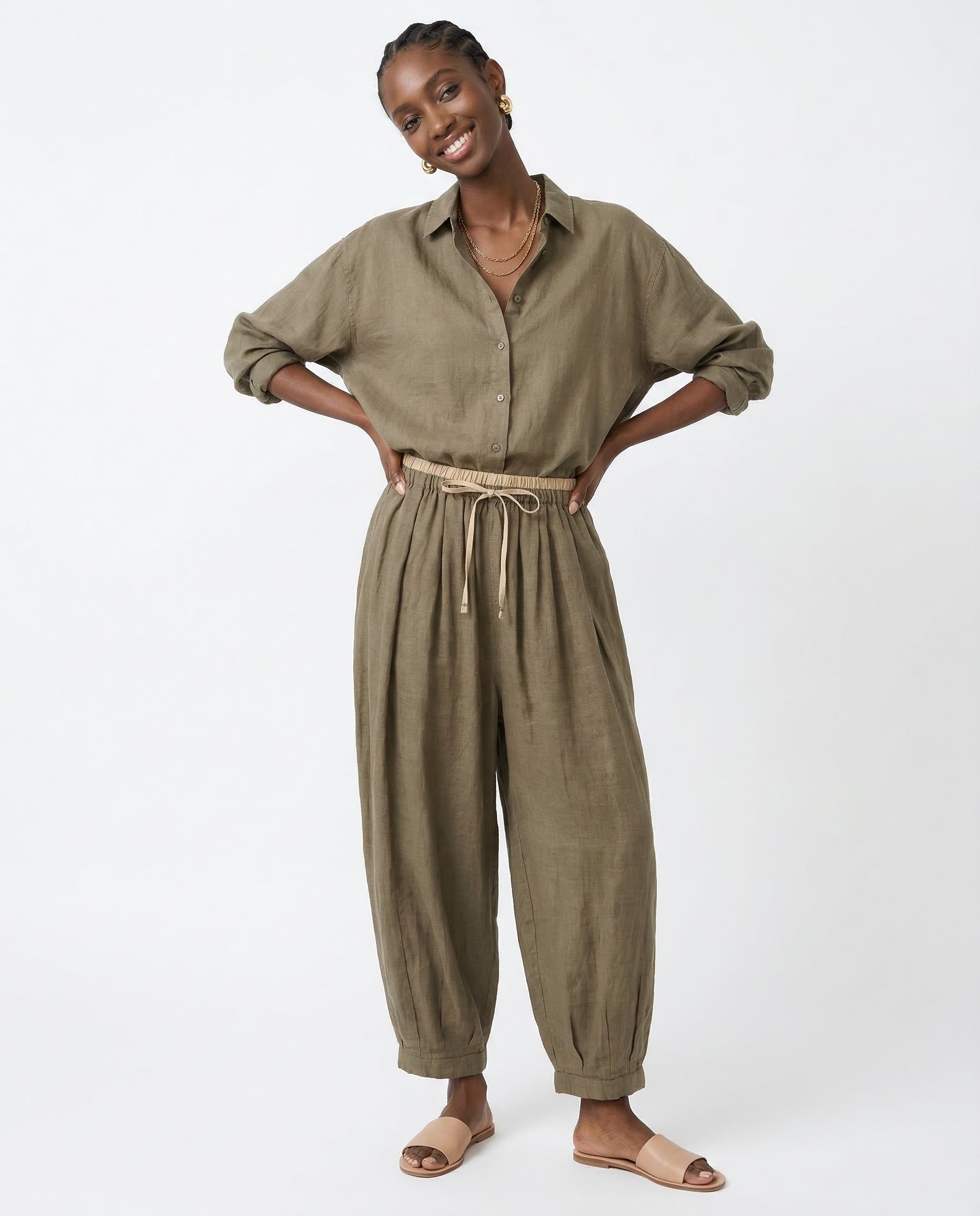 Detail shot of front pocket on peach linen trousers