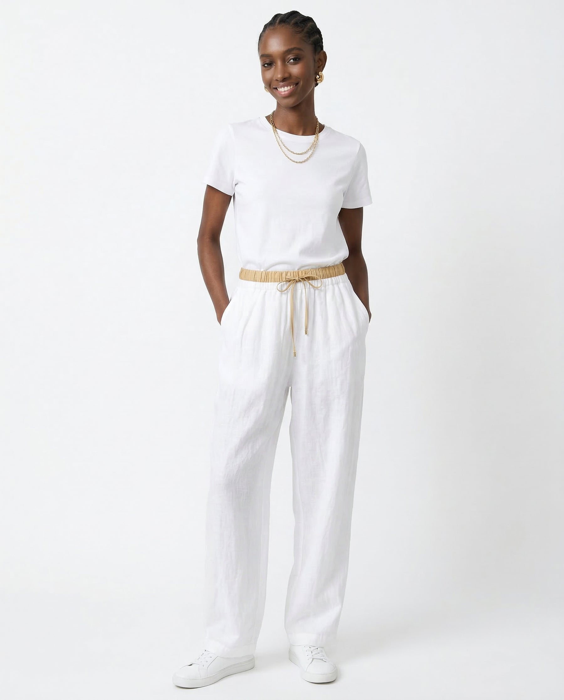 Model walking in peach linen tapered trousers, dynamic movement shot