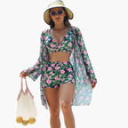 Model wearing floral bikini top with adjustable shoulder straps and rear tie closure