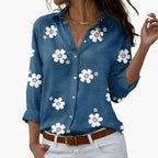 Close-up detail of white daisy motif and fabric texture
