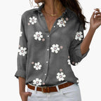 Model wearing floral shirt in relaxed pose, front view