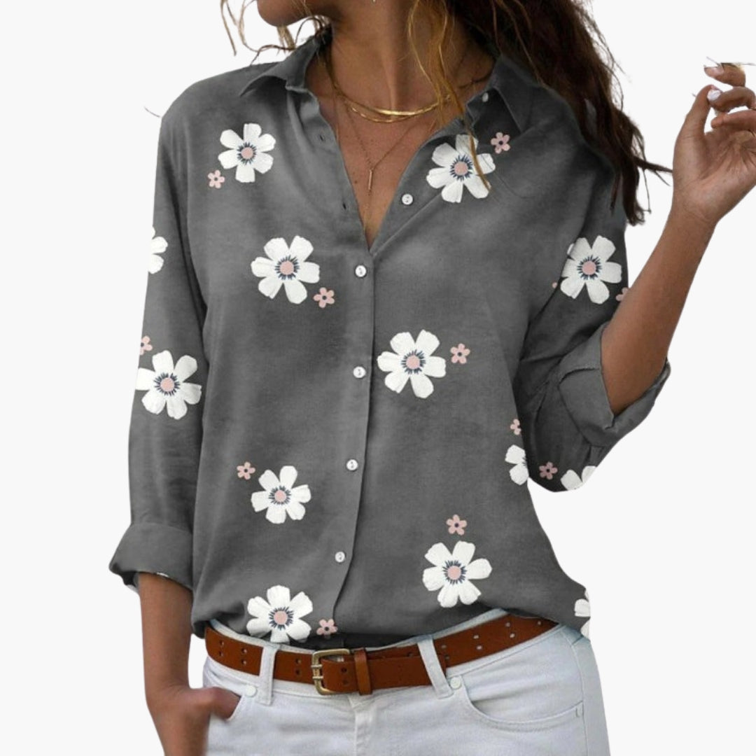 Model wearing floral shirt in relaxed pose, front view