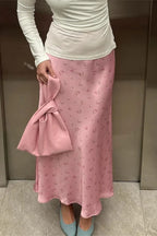 Side profile of bias-cut satin skirt demonstrating silhouette