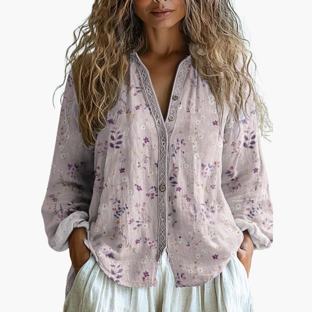 Woman wearing purple embroidered blouse, styled outfit detail