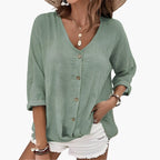 Women's sage green blouse with button front and V-neckline, displayed flat