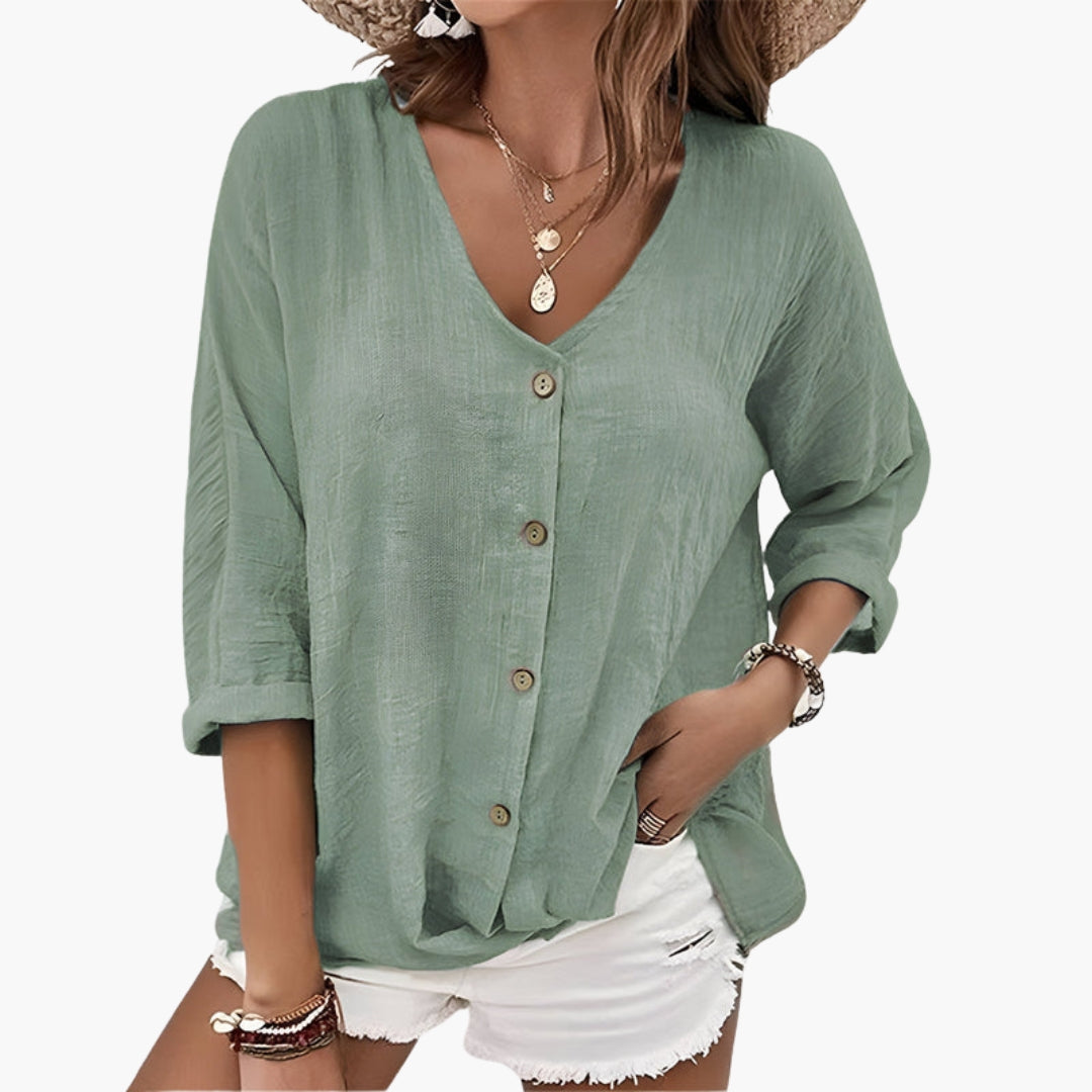 Women's sage green blouse with button front and V-neckline, displayed flat