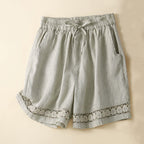 Women's cotton shorts with lace trim, front view on white background