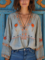Sage green boho blouse with embroidered bodice and V-neckline, front view
