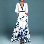 Woman wearing floral embellished sage green maxi dress, full-length front view