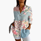 Model wearing floral embroidered shirt, front-facing pose