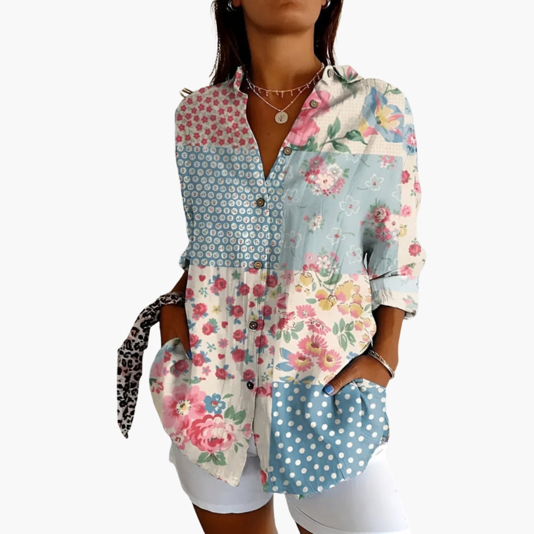 Model wearing floral embroidered shirt, front-facing pose