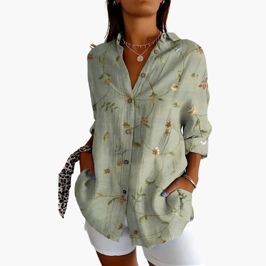Women's floral embroidered sage green button-front shirt on white background