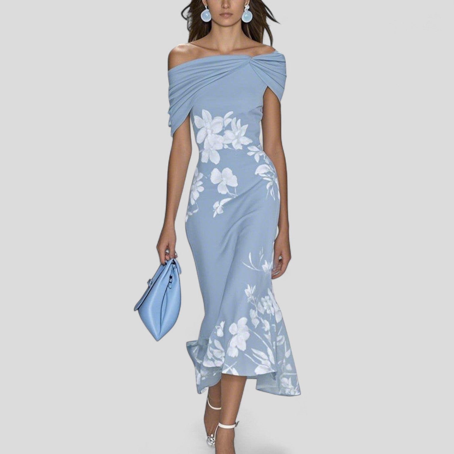 Model wearing floral maxi dress, side profile showing draped off-shoulder detail