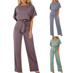 Side angle of wide leg trousers and flowing silhouette