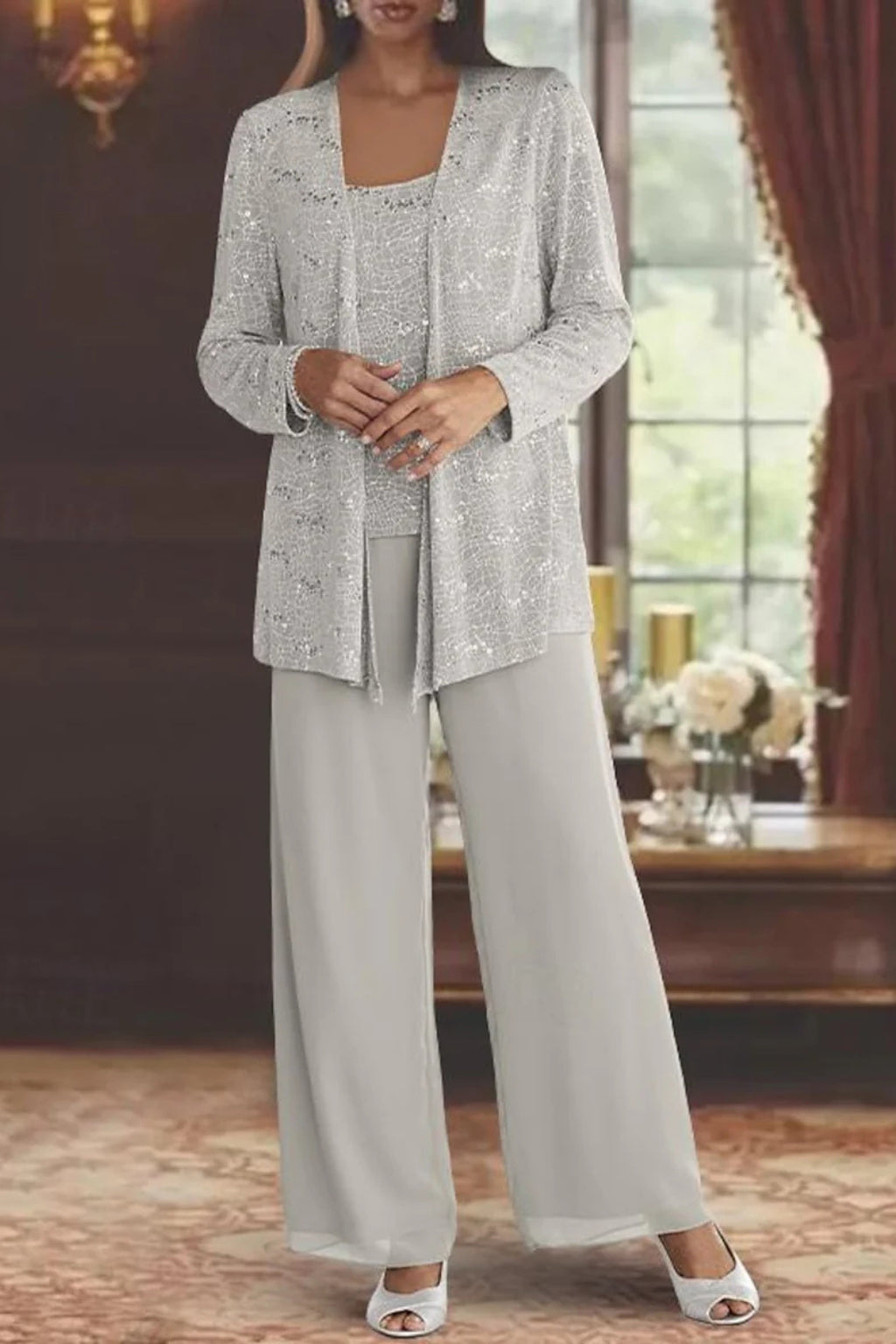 Model wearing sequin jacket and wide leg trousers, full-length pose