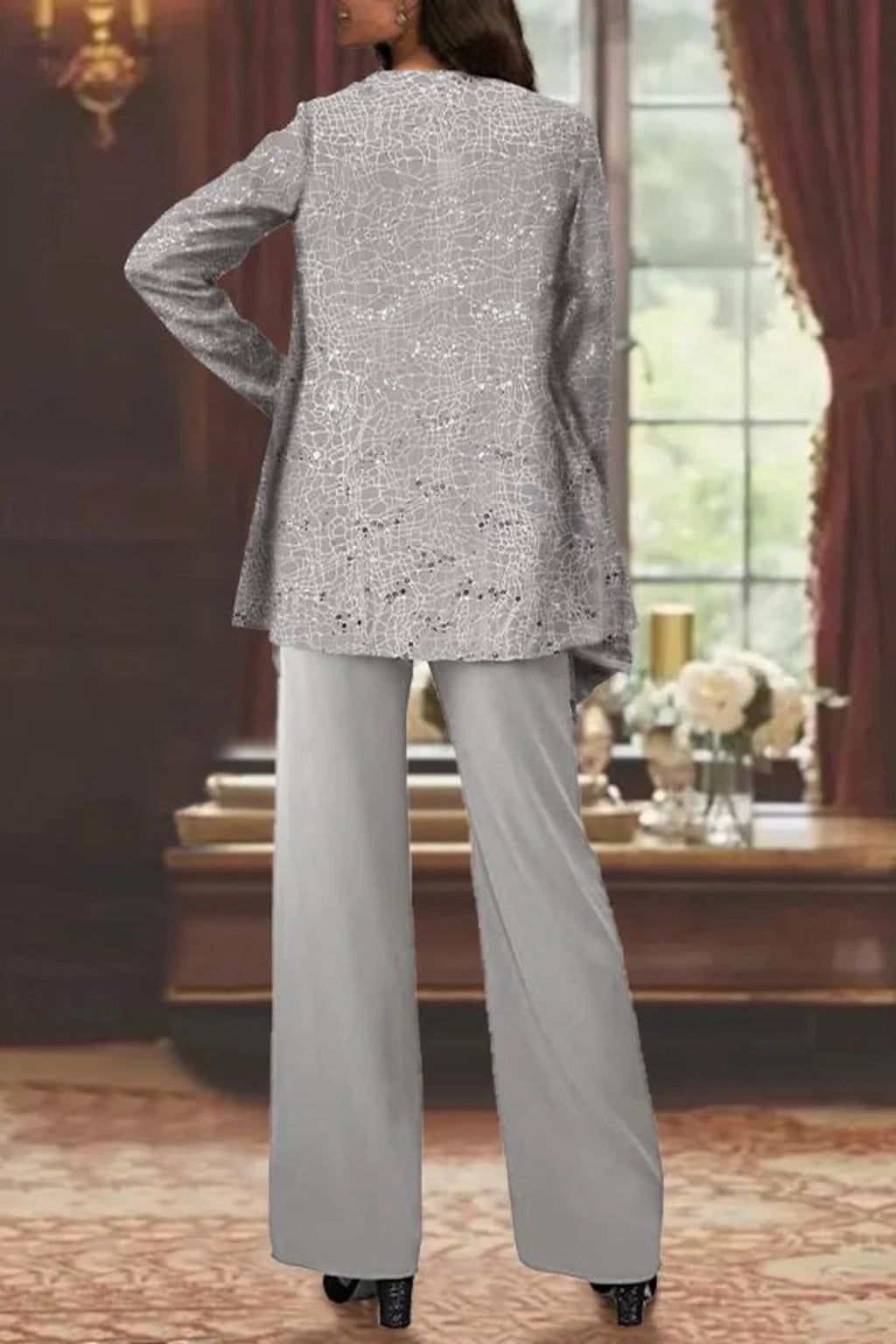 Side profile of model in complete sequin suit ensemble
