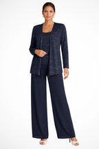 Model posing with hands on hips in sequin trouser suit