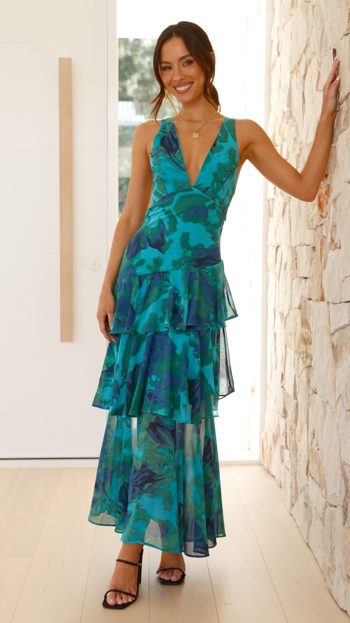 Model wearing tiered maxi dress, standing pose showing full length