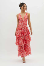 Model in maxi dress, three-quarter turn pose