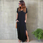 Model wearing v-neck maxi dress, standing pose showing full silhouette