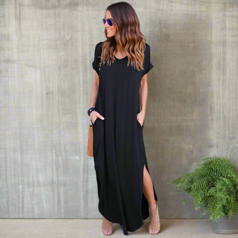 Model wearing v-neck maxi dress, standing pose showing full silhouette