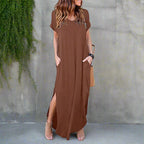Model in v-neck maxi dress seated, showing comfort and relaxed fit