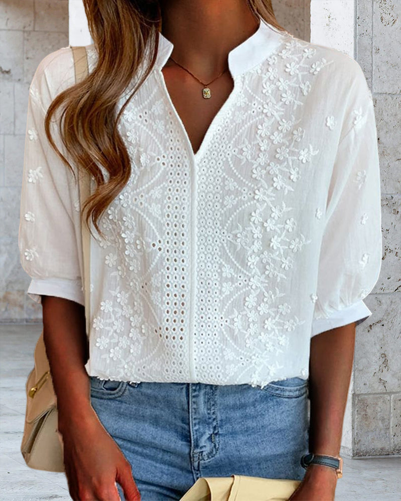 Full-length view of embroidered blouse styled for occasion wear