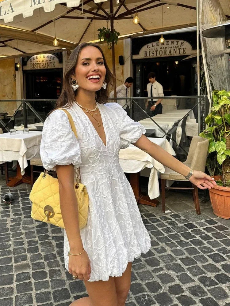 White embroidered lace mini dress with puff sleeves, front view