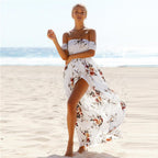 Woman wearing white floral off-shoulder maxi dress, front view