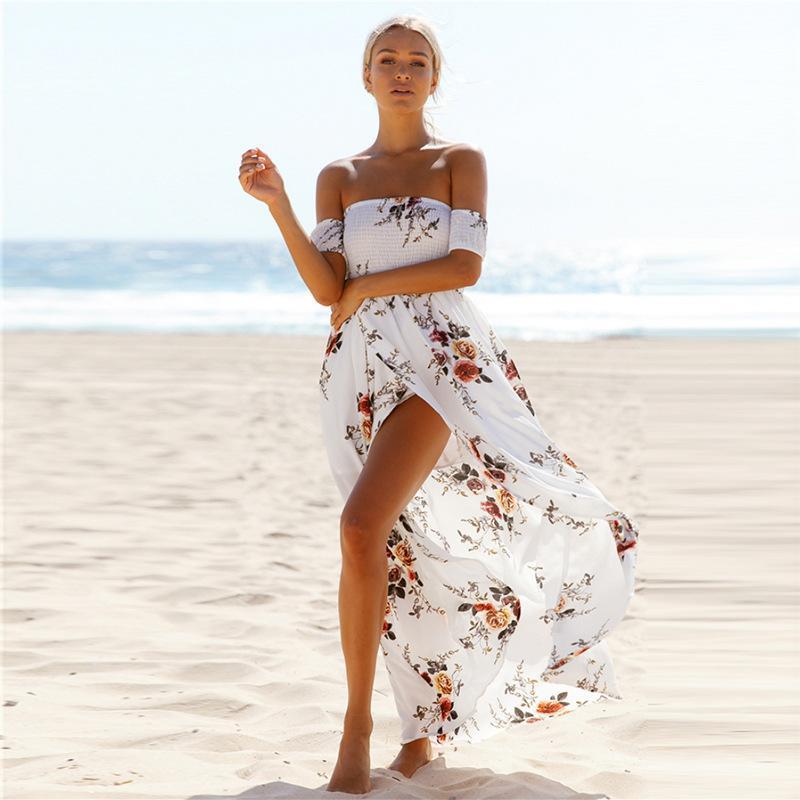 Woman wearing white floral off-shoulder maxi dress, front view