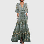 Model wearing white floral maxi dress, side profile showing A-line silhouette