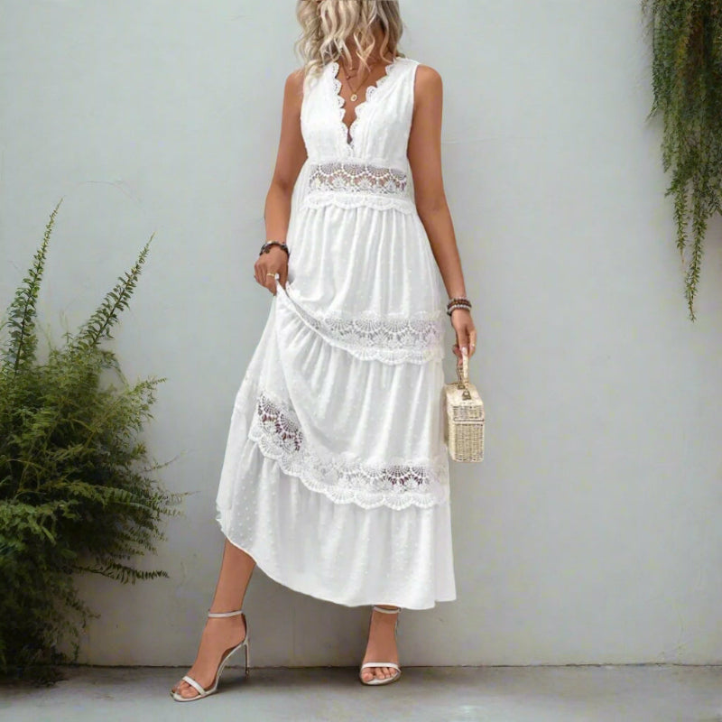 White lace tiered maxi dress with sleeveless V-neckline, displayed on model