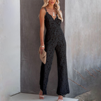 Model in white lace jumpsuit, side angle showing wide leg silhouette
