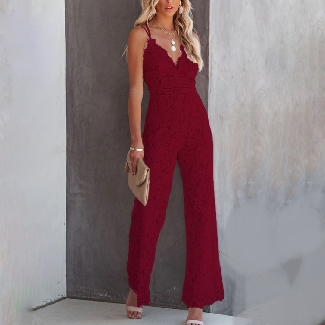 Model wearing white lace jumpsuit, full-length pose
