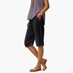 Side view of relaxed fit linen shorts on model
